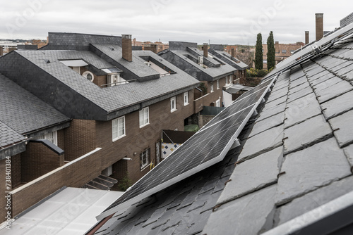 Sloping black slate tile roofs in an urbanization of single-family residential buildings