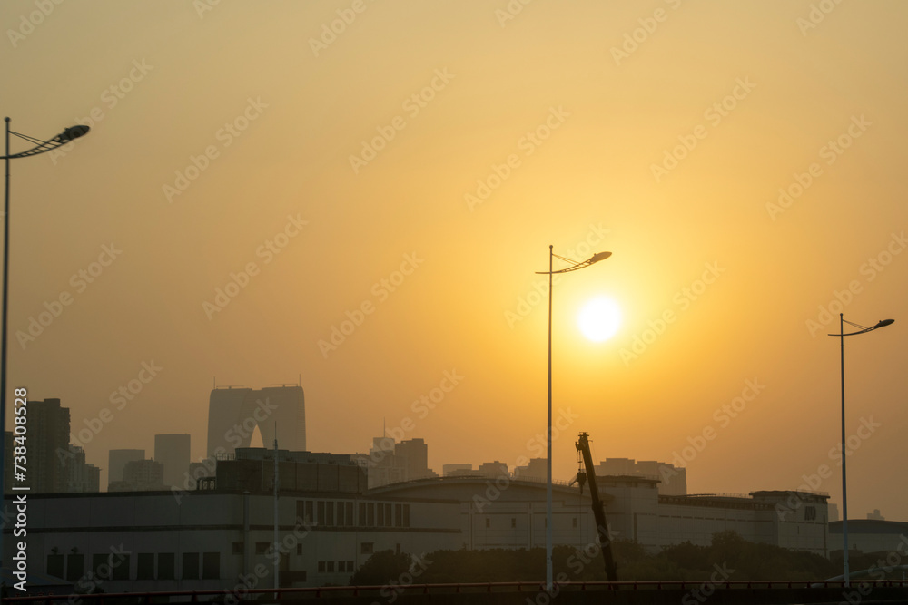 Golden sun during sunset and lamp post