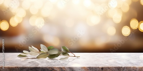 Luxury restaurant with empty marble table and soft blurred light  featuring a leaf in the foreground and bokeh background. Suitable for product display or business presentation.