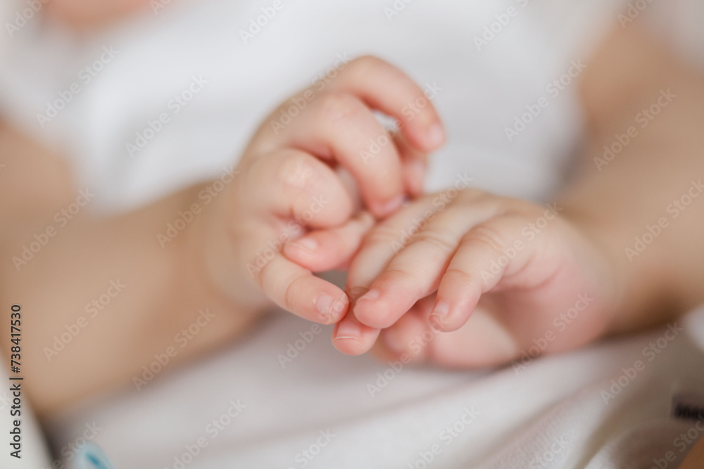 Macro Close up of Baby Hands in Studio with Natural Light Macro Close up of Baby Hands in Studio with Natural Light