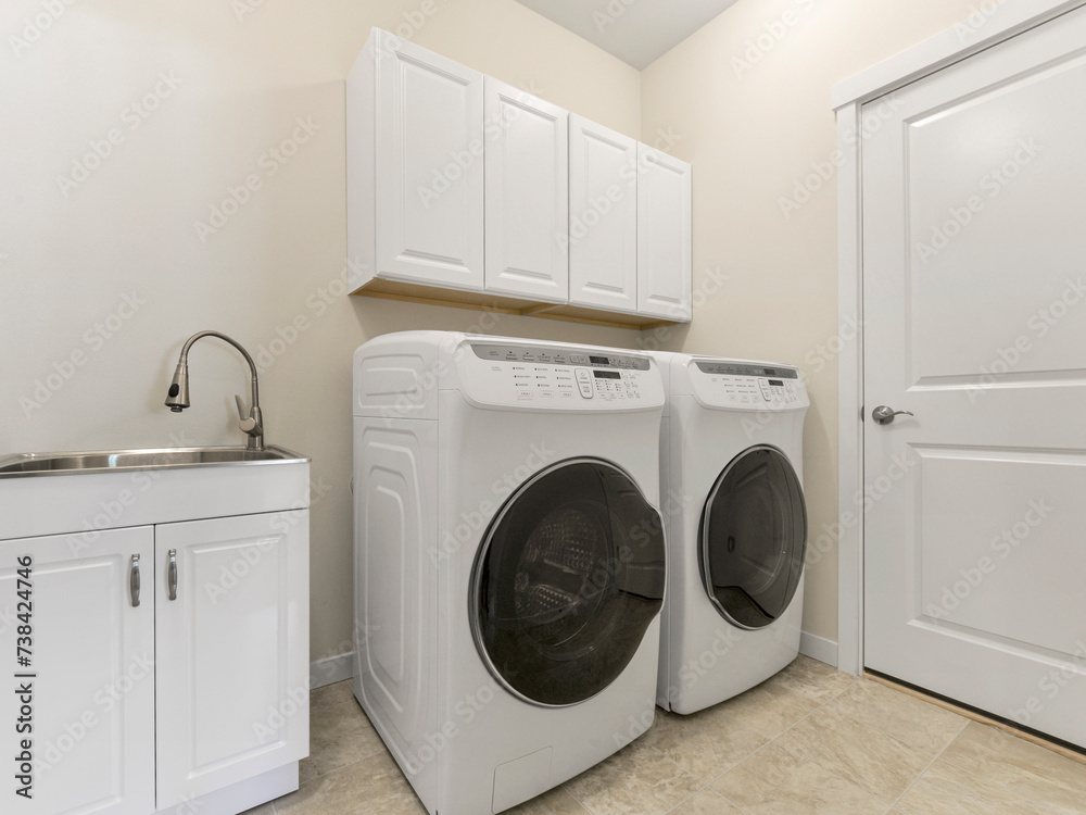 Modern residential laundry room interior Modern residential laundry room interior