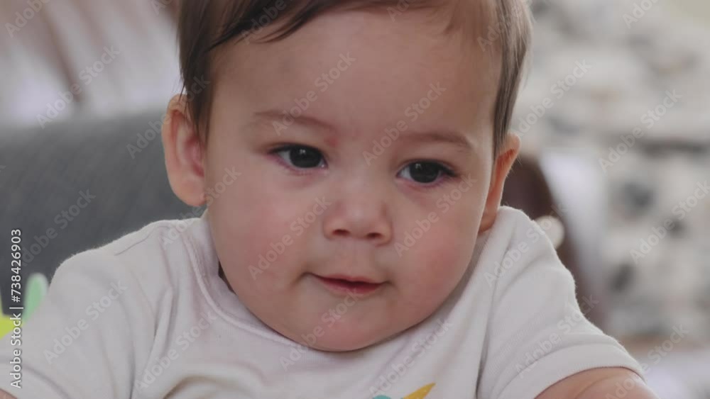Closeup shot of a baby boy playing in his activity center Closeup shot of a baby boy playing in his activity center