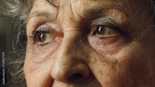 old woman eyes, closeup footage on pensive sad eyes photo