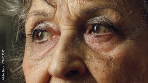 old woman eyes, closeup footage on pensive sad eyes
