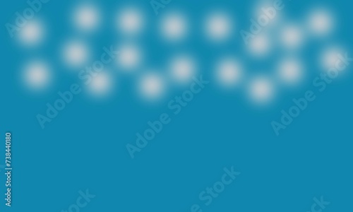 White bokeh on blue background for Christmas