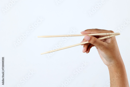 Hand Holding Bamboo Chopstick