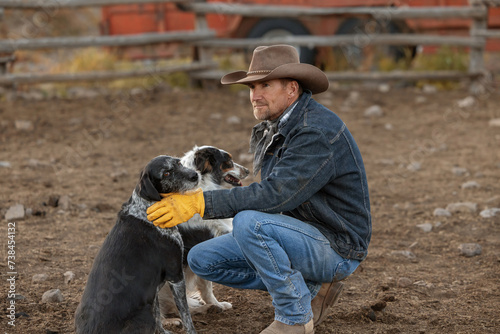 Photography Cowboy with ranch dogs