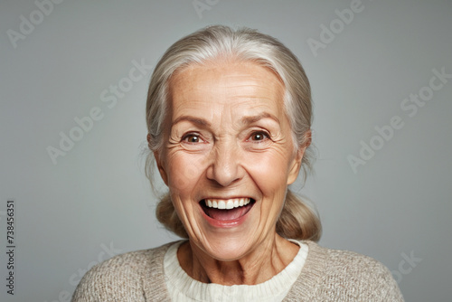 Portrait of senior female smiling woman looking at camera laughing © Iurii