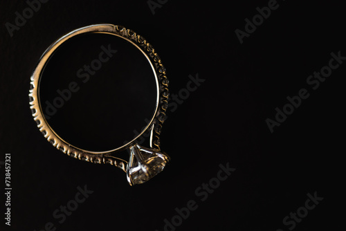 A wedding ring is a finger ring typically worn on the base of the left ring finger, usually forged from metal, traditionally gold or another precious metal. indicates that its wearer is married