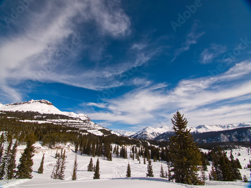 snow capped mountain peaks under blue sky in colorado 