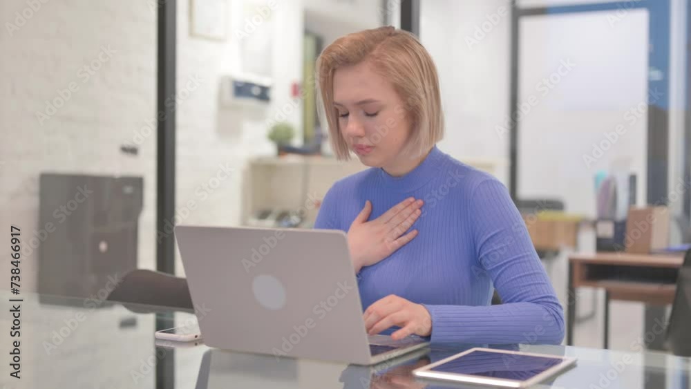 Coughing Young Woman Using Laptop in Office Coughing Young Woman Using Laptop in Office