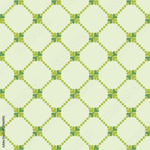 Seamless pattern clover leaves.Lucky magical plant. Background for St.Patrick's Day.Cute green shamrock four leaf. Irish Celtic folk.Pixel embroidery,ethnic,cross stitch style Vector illustration.