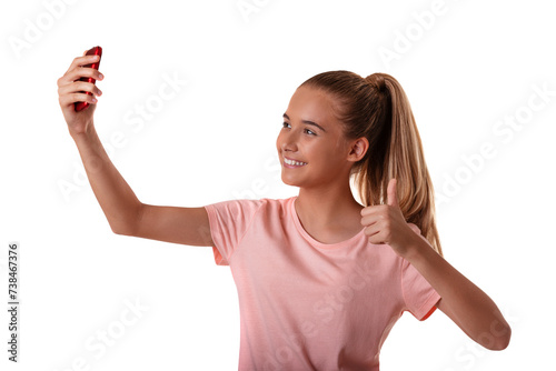 Portrait of beautiful young fit girl making selfie with smartphone and showing ok sign isolated on white background