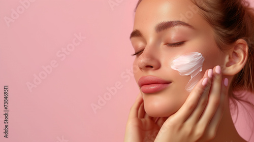 Woman applying moisturizer cream on face, skincare routine with space for text