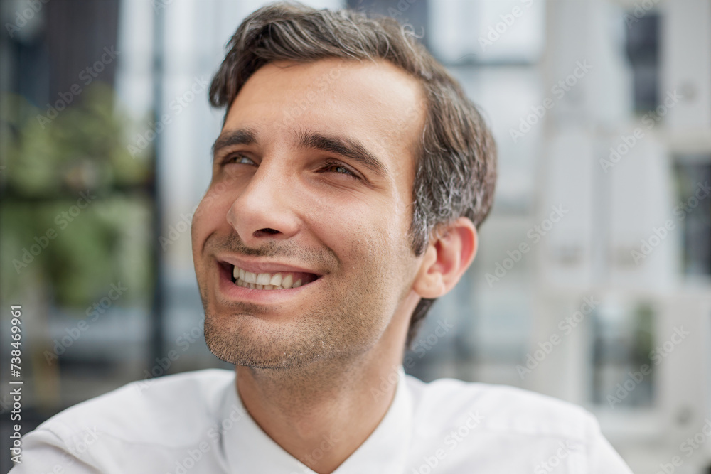 Confident young businessman posing in the office Confident young businessman posing in the office