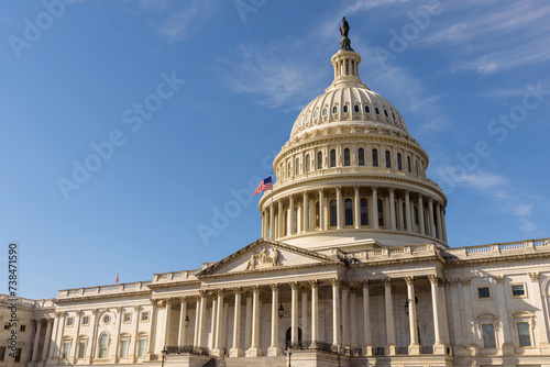 The United States Capitol building with the American flag flying atop its flagpole, Washington DC photo