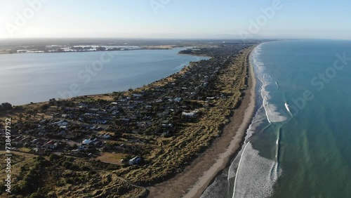 aerial panorama of christchurch city, new brighton beach, southshore and sumner beach at sunset;  photo