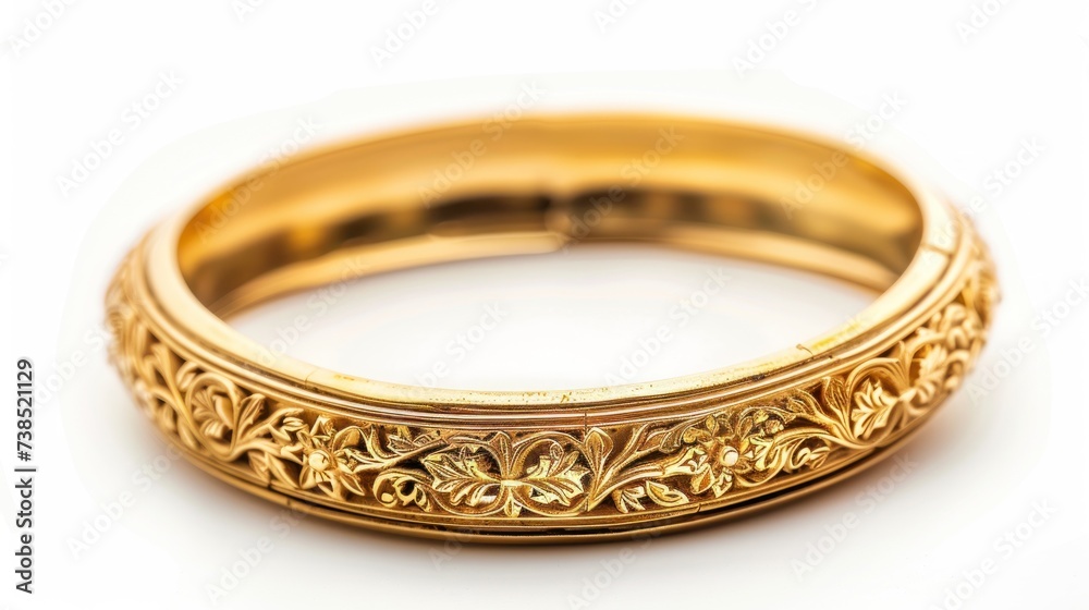 Big gold bangle bracelet with beautiful pattern isolated on white background. Big gold bangle bracelet with beautiful pattern isolated on white background.