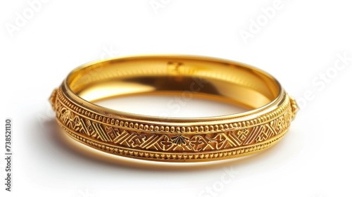 Big gold bangle bracelet with beautiful pattern isolated on white background.