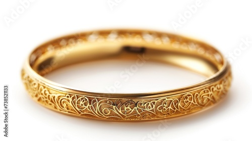 Big gold bangle bracelet with beautiful pattern isolated on white background.