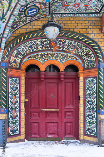 St. Petersburg. View of gate to apartment house N. Nikonov 1900 on Kolokolnaya Street 11, called by locals fairy-tale house, decorated with mosaics in Russian style © Katvic