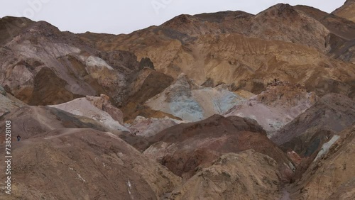 Pan-Multi colored hills of Artist Palette. Iron-rich hematite gives reds and pinks, iron oxides yield yellows and golds, volcanic ash deposits give greens and manganese creates purple - Death Valley