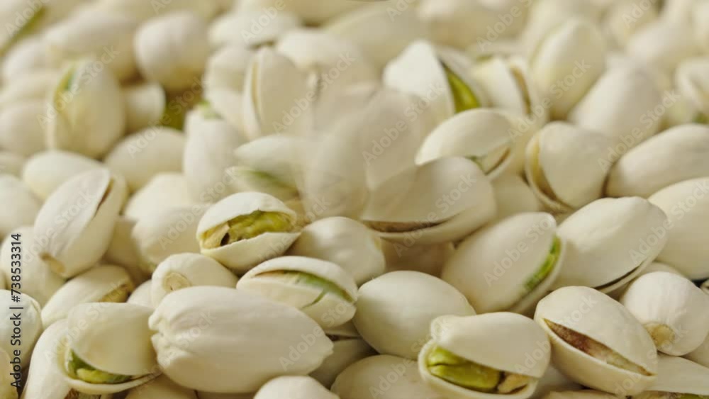 roasted salted pistachio nuts background. roasted salted pistachio nuts background.