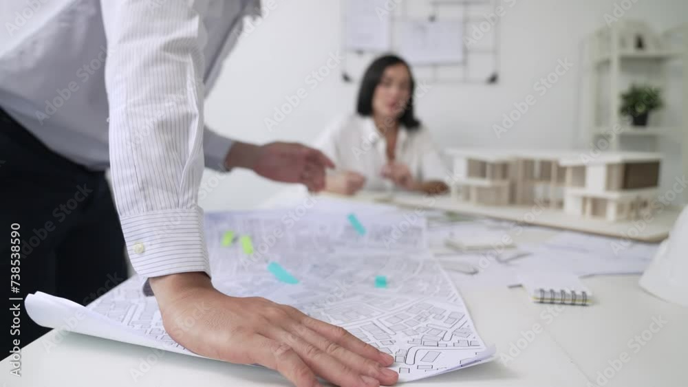 Skilled caucasian interior designer working with house model while ...