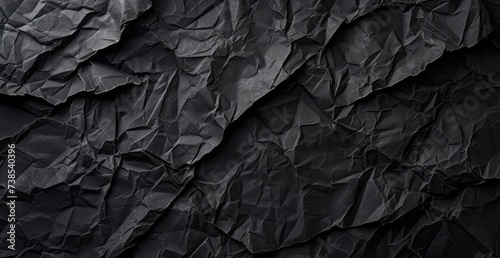 A black textured cloth background, featuring a seamless pattern, creased, crinkled, and wrinkled aesthetics, use of paper, and a dark atmosphere.