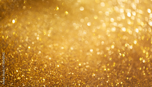 Abstract sparkle background template gold color banner with copy space. Christmas blur glitter bokeh gold festive backdrop. blurred texture sparkling magical dust