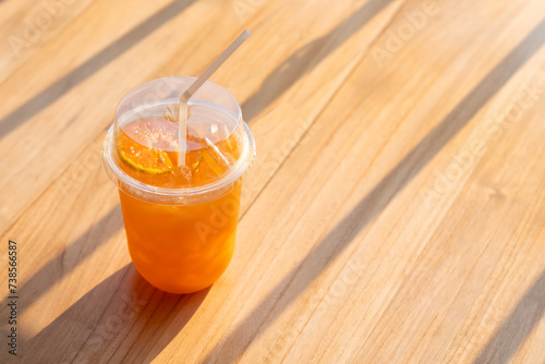 Orange Juice in cup with straw