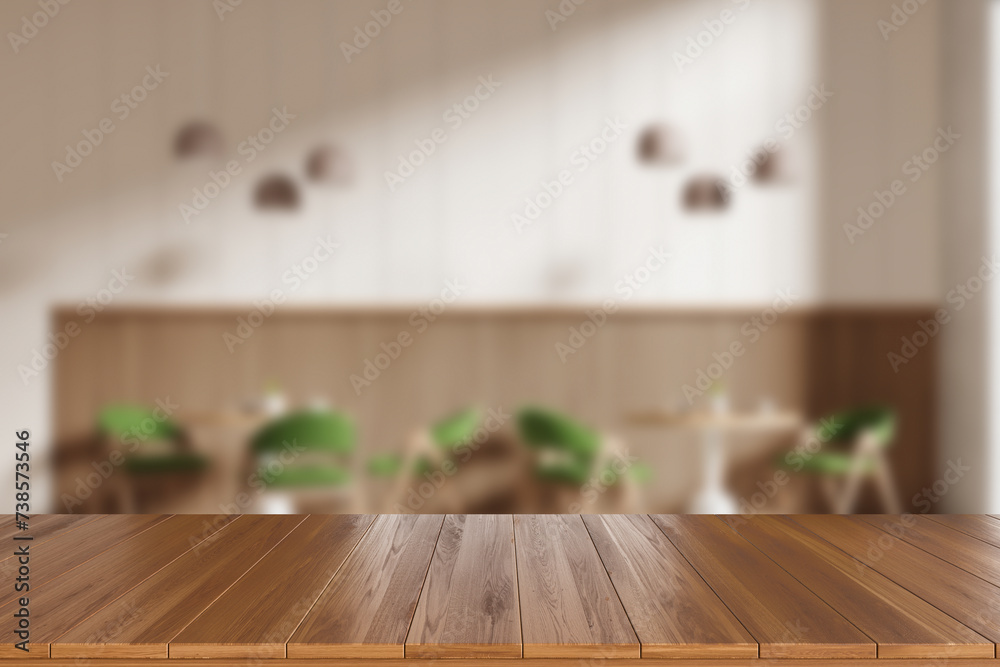 Wooden desk and blurred cafe interior with seats and table near window. Mockup Wooden desk and blurred cafe interior with seats and table near window. Mockup