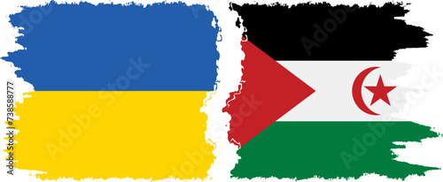 Western Sahara and Ukraine grunge flags connection vector