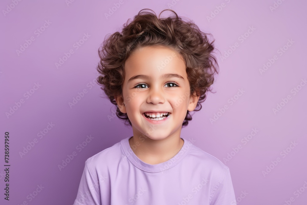 Portrait of a happy little girl with curly hair, isolated on purple background Portrait of a happy little girl with curly hair, isolated on purple background