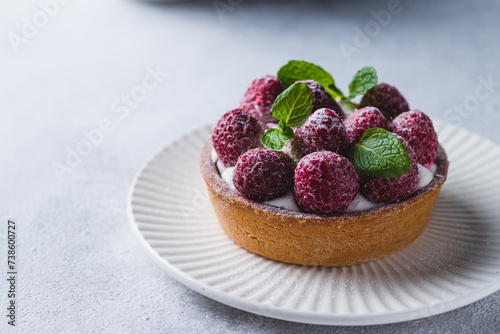 A cake with berries. Tartlet with raspberries