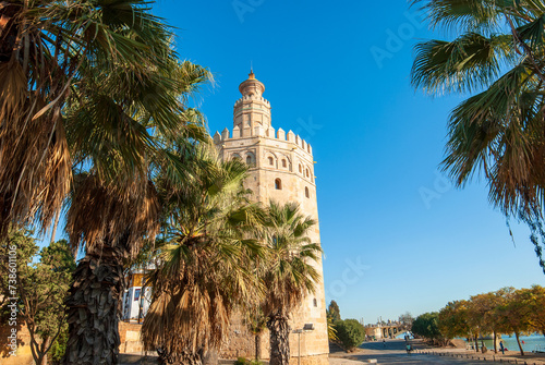 the gold tower along the guadalquivir river in seville, spain photo