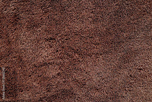 Absorbent fabric texture. Closeup of brown towel photo