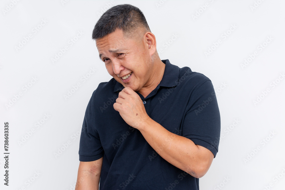 Portrait of a shy middle-aged man showing bashfulness while smiling, isolated on a clean white background with copy space. Portrait of a shy middle-aged man showing bashfulness while smiling, isolated on a clean white background with copy space.