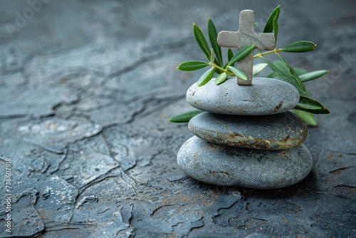 some stones and olive leaves with a cross