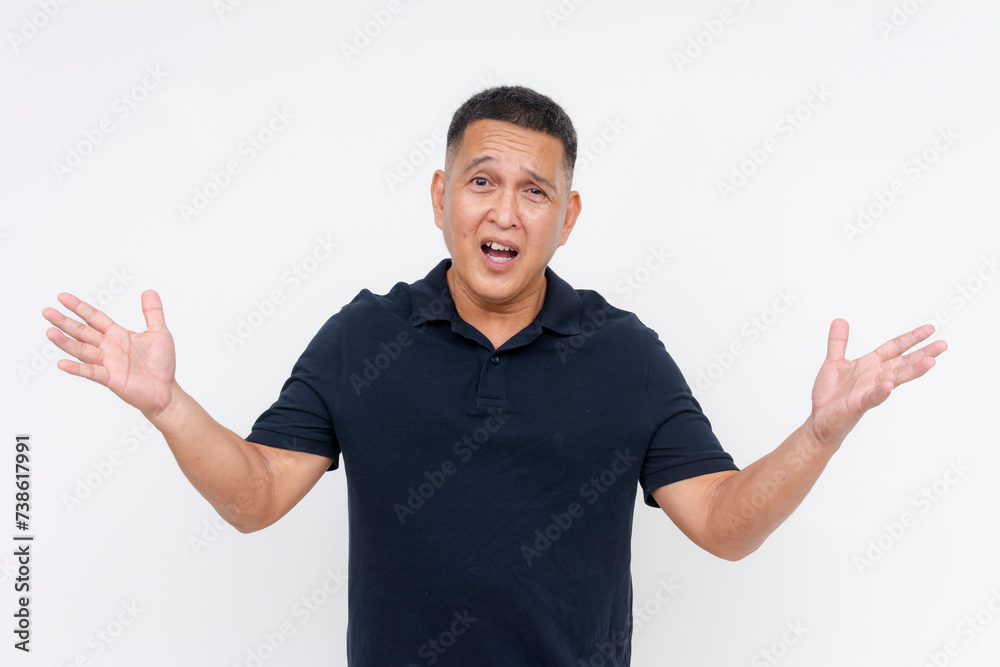 A Perplexed Asian adult male in casual attire expressing uncertainty with a shrug, isolated on a white background. A Perplexed Asian adult male in casual attire expressing uncertainty with a shrug, isolated on a white background.