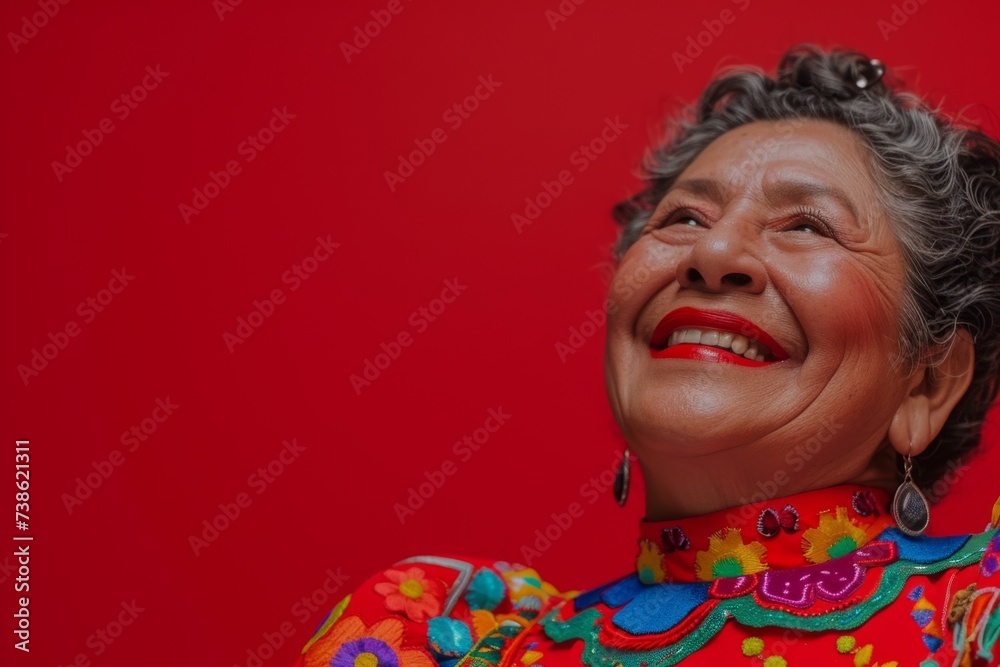 Senior Woman in Festive Mexican Outfit Laughing, Red Background. Senior Woman in Festive Mexican Outfit Laughing, Red Background.