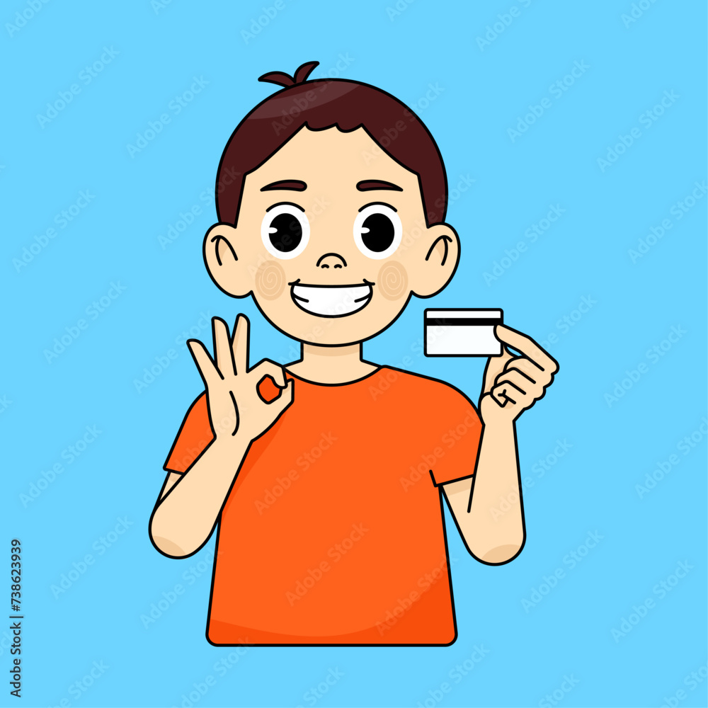 Boy recommends and holds plastic credit card, other hand shows OK sign Boy recommends and holds plastic credit card, other hand shows OK sign