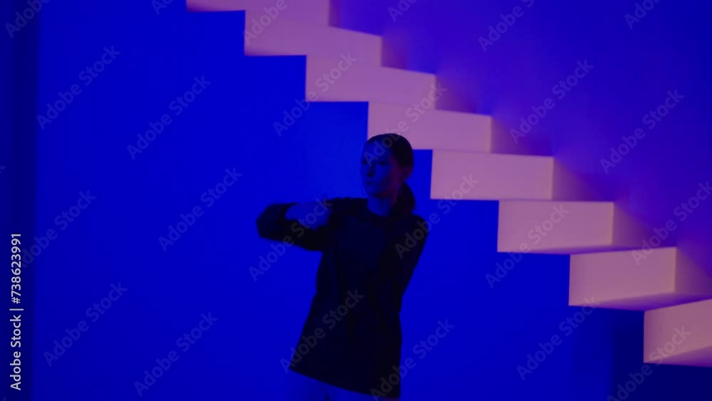 Pretty Young Woman Dancing Alone In Studio, Medium Portrait Shot, Contemporary Choreography Pretty Young Woman Dancing Alone In Studio, Medium Portrait Shot, Contemporary Choreography