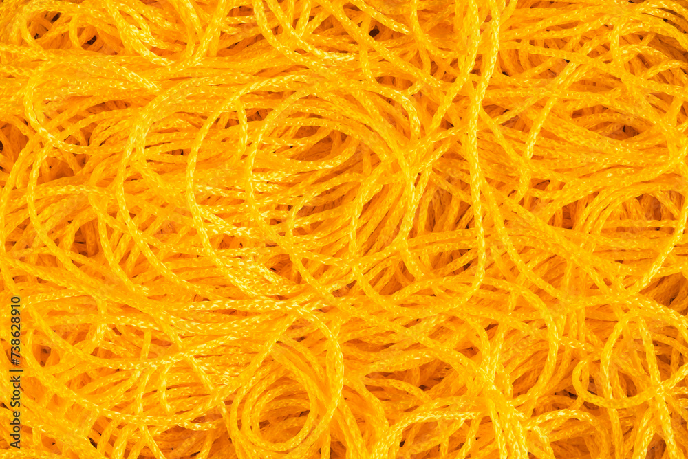 Chaotic lying yellow cord, abstract background pattern Chaotic lying yellow cord, abstract background pattern
