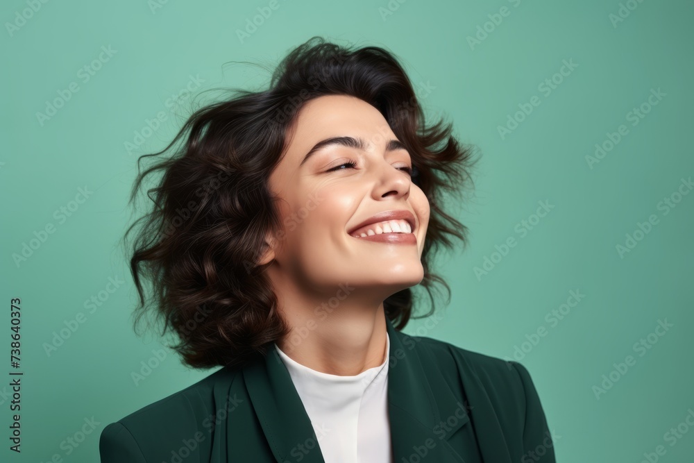 Portrait of happy smiling young business woman, over green background. Portrait of happy smiling young business woman, over green background.