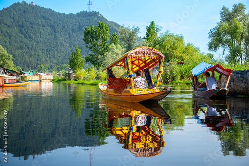 Dal Lake and the beautiful mountain range in the background in the summer Boat Trip of city Srinagar Kashmir India.	 photo