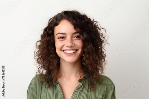 Portrait of a beautiful young woman with curly hair on white background