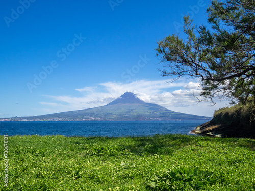 View across the channel from Faial to Pico Mountain photo