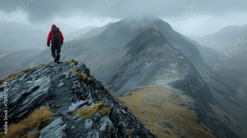 Lone Hiker Trekking Through Rugged Mountain Terrain at Dusk © photolas
