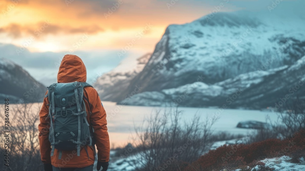 Explorer with Backpack Gazing at Sunrise Over Majestic Mountain Landscape Explorer with Backpack Gazing at Sunrise Over Majestic Mountain Landscape